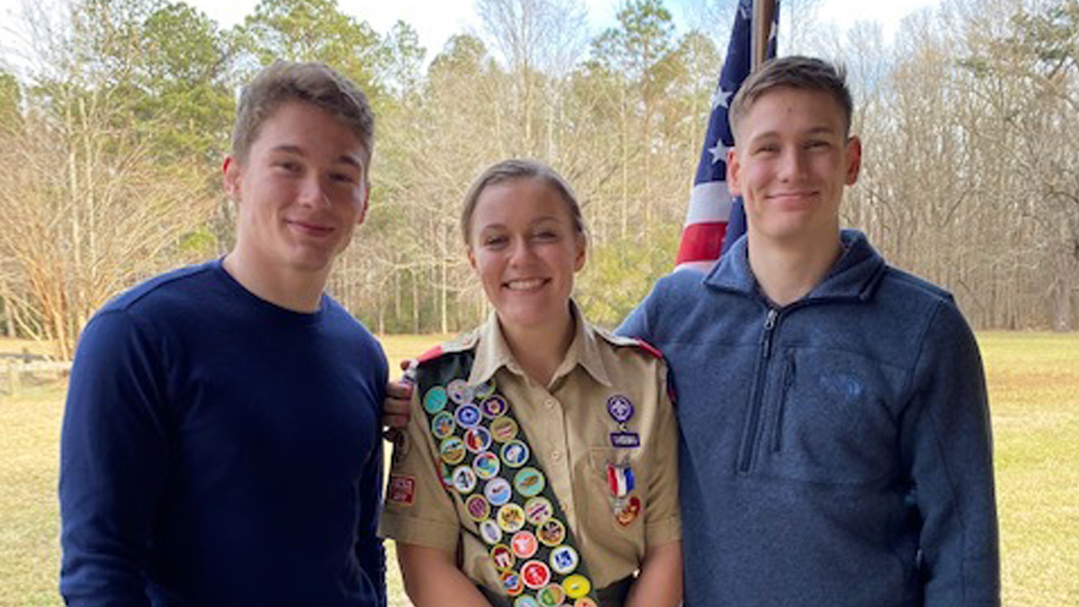 Photo courtesy of Virginia Cameron. Emma Cameron with her twin brothers, Douglas (left) and Ian (right) Cameron. Emma is part of the first class of Female Eagle Scouts in the country. 
