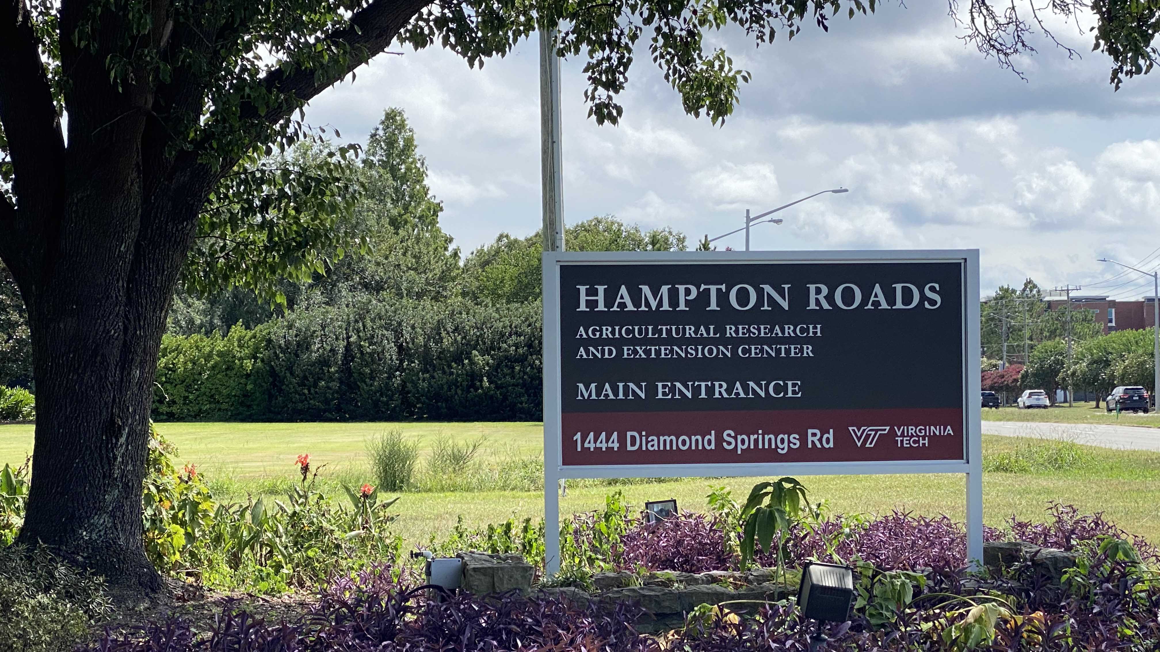 Photo by Katherine Hafner. A sign marks the entrance to the Hampton Roads Agricultural Research and Extension Center in Virginia Beach.