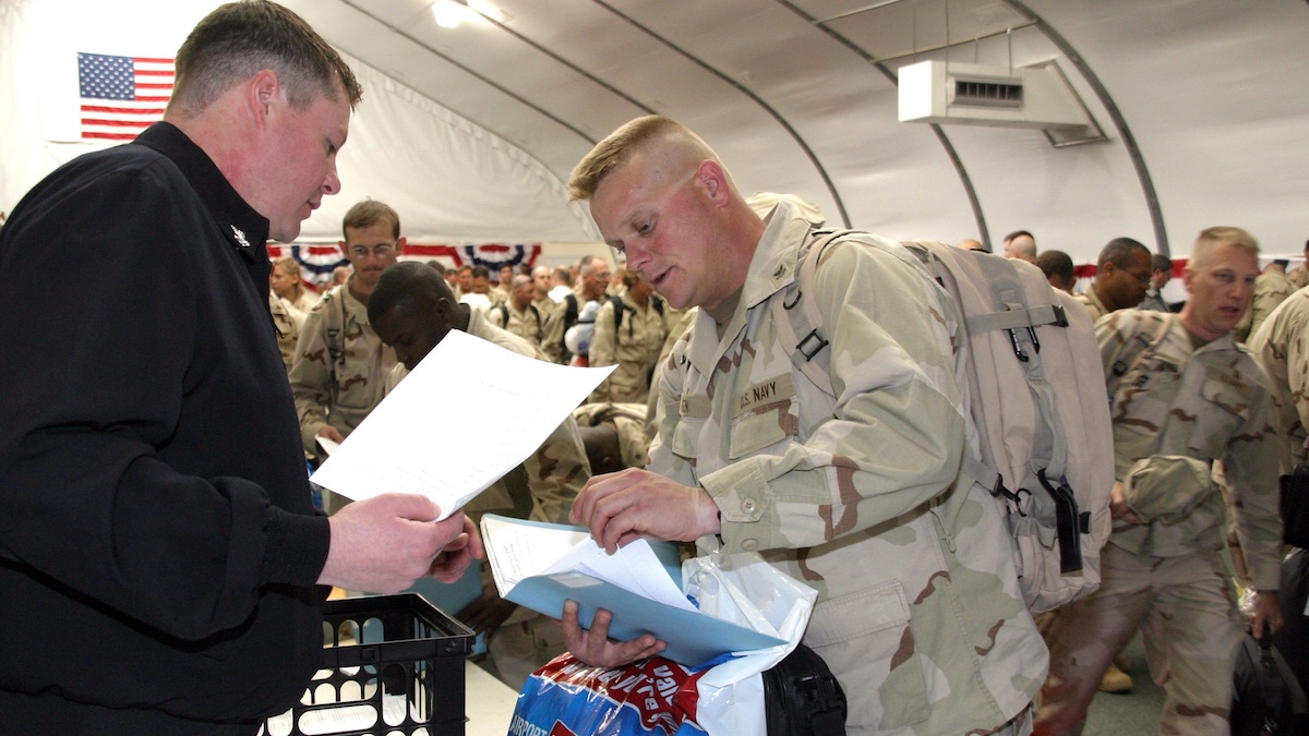 Photo courtesy of the U.S. Navy. Sailors returning to Norfolk in 2007 submit paperwork to leave active duty. Recently, there's been a delay in getting that paperwork to personnel. 