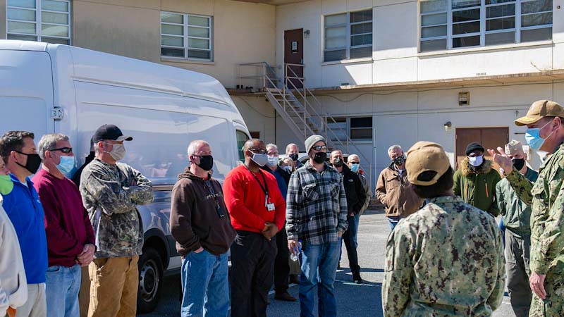 The Navy recognizes Hampton Roads area public works department employees for responding quickly to a ruptured main at privately run Navy housing in March 2021. (Image via Department of Defense)