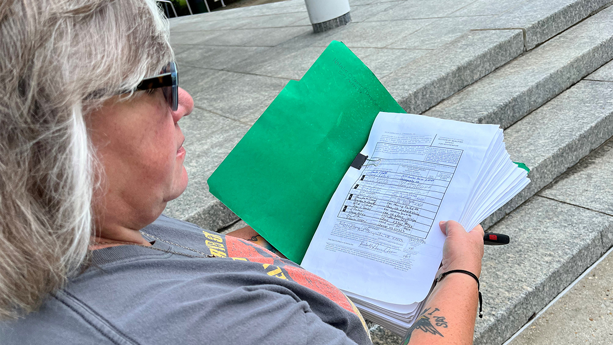 Renee Cobb, one of the organizers behind the Rural Chesapeake Preservation Committee petition drive, stands outside the Chesapeake courthouse Wednesday. (Photo by Ryan Murphy)