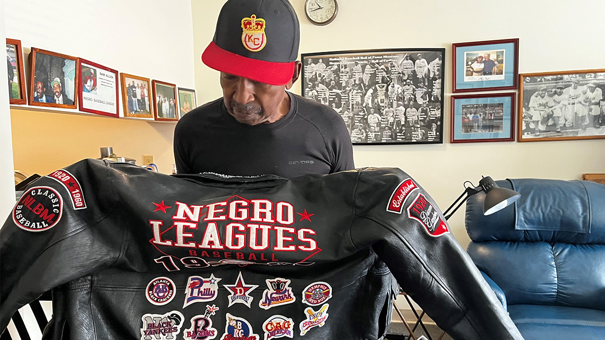 Photo by Ryan Murphy. Negro Leagues Hall of Famer and Norfolk native Sam Allen shows off a jacket commemorating the teams of the Negro Leagues.