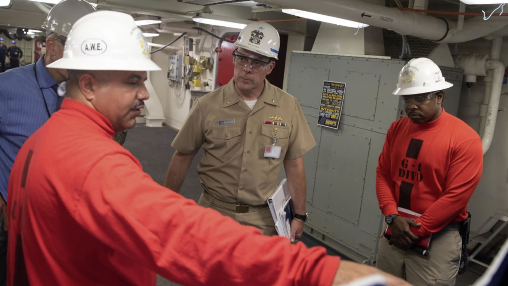 Rear Adm. Eric Ver Hage, middle, tours USS Ford during construction at Newport News in 2019. (Image: Department of Defense)