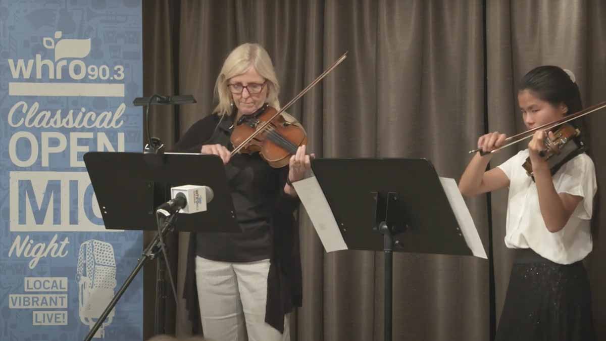 Valerie Dunkle and Katie Dunkle play a violin duet.