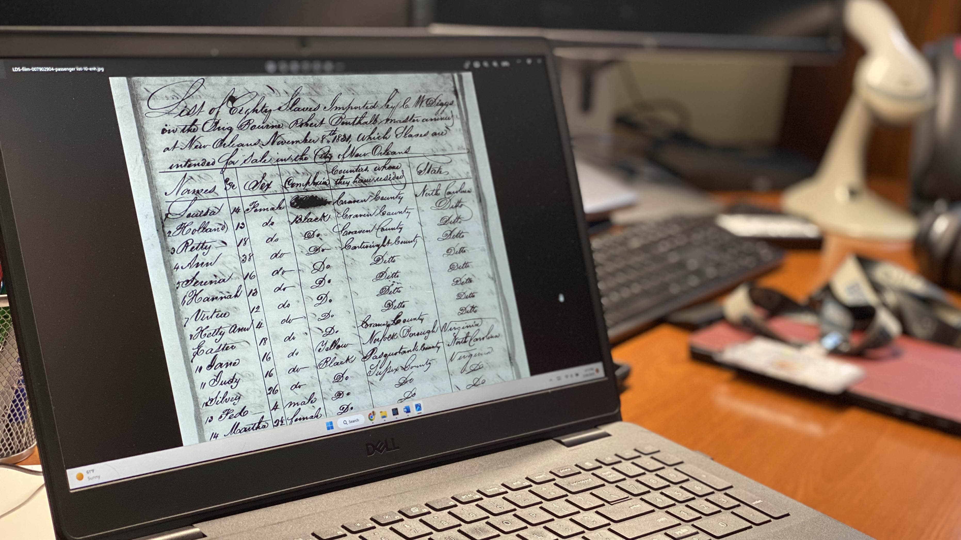 The laptop of librarian Troy Valos displays one of the ship manifests transcribed for the Sold Down River project. (Image: Katherine Hafner)
