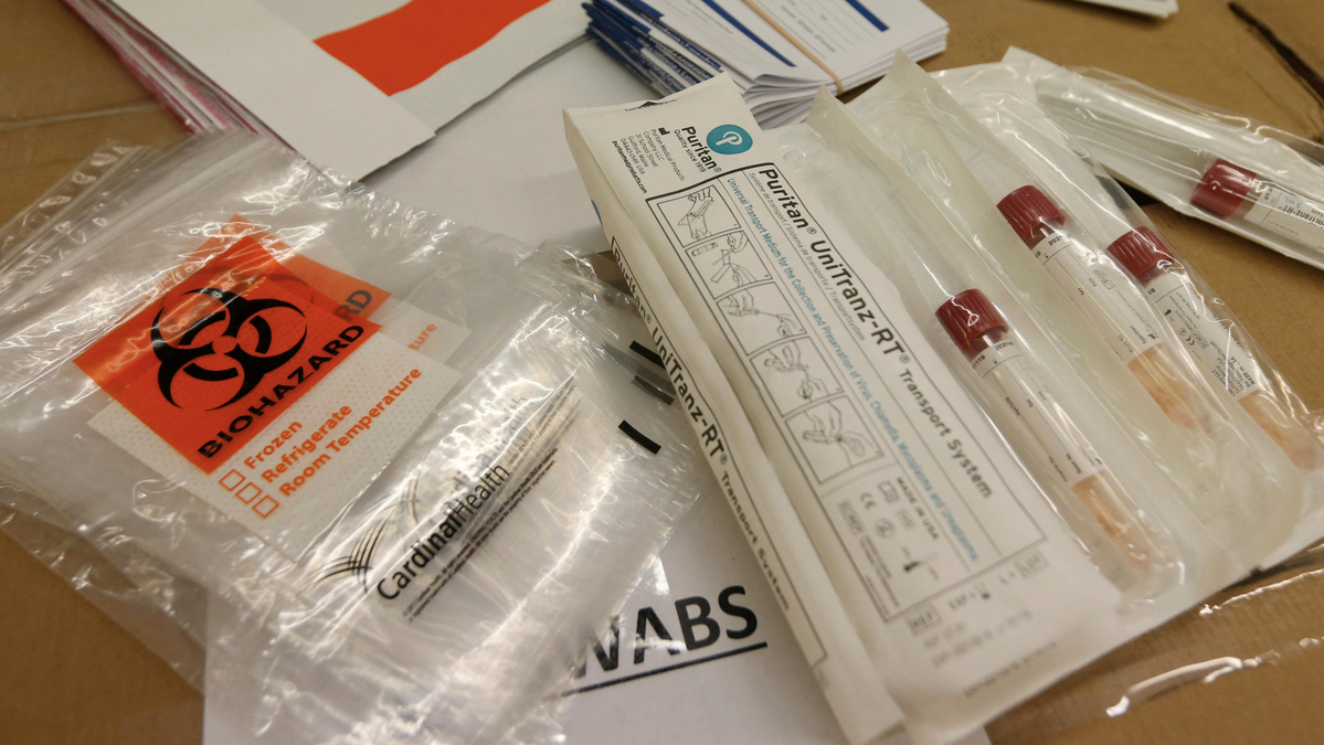  Covid-19 test kits are prepared at the Genetworx clinical lab in Glen Allen. Credit (AP Photo/Steve Helber)