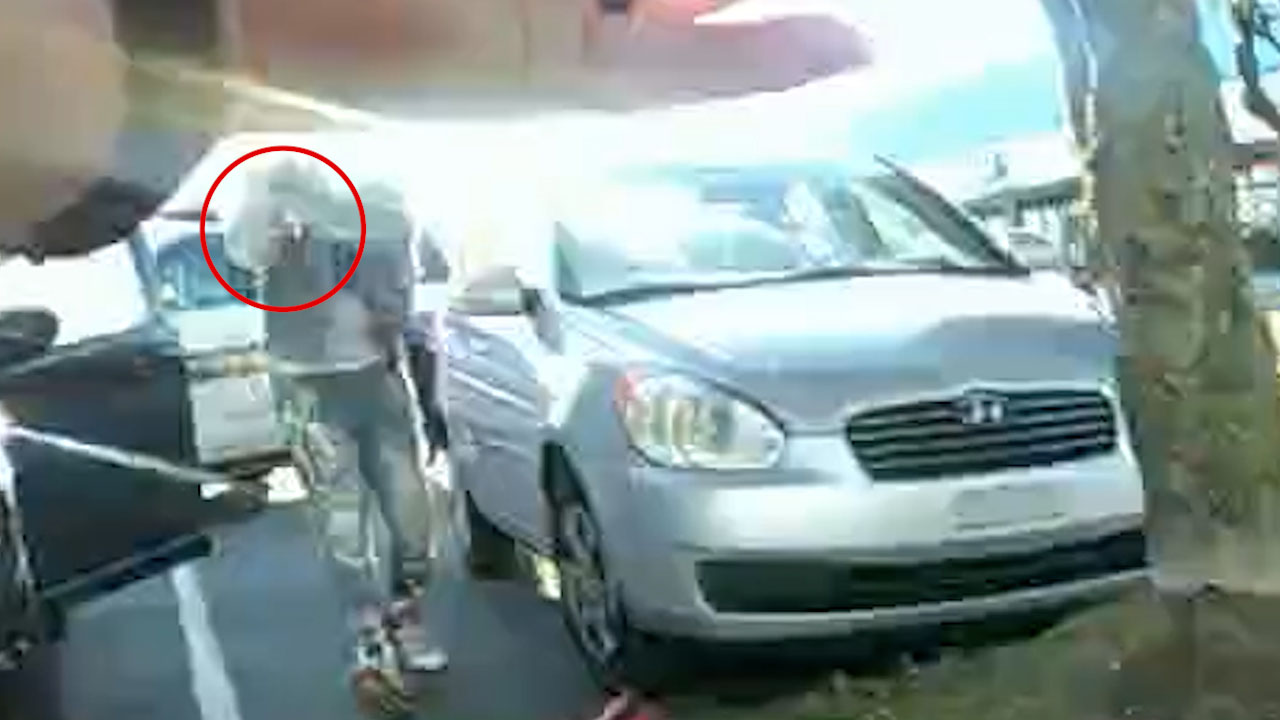 Screenshot courtesy of Virginia Beach Police Department. In body camera footage of the fatal shooting of Deshawn Whitaker, the sun distorts the view of Whitaker’s weapon. A later frame shows a gun on the ground after the officer shoots Whitaker.