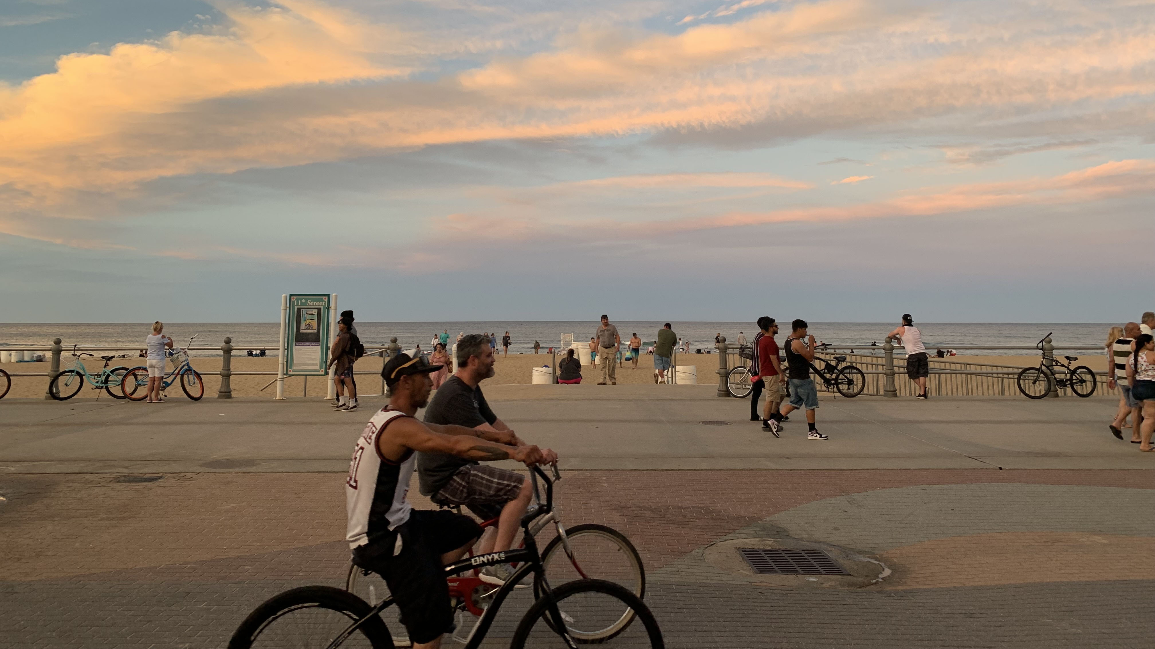 Beachgoers at the Oceanfront in Virginia Beach on a hot evening in July 2022. (Photo by Katherine Hafner)