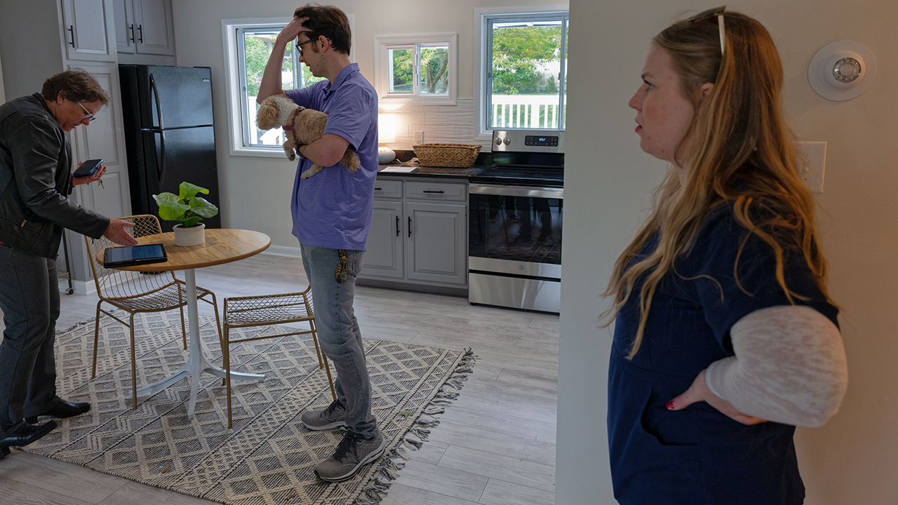 Ellie Jernigan, 27, and her husband Zach, 30, discuss putting a bid on a home for sale in Henrico County with their realtor Dare Tulloch. They are first-time homebuyers and have been looking for months to purchase a home so they might start a family.
