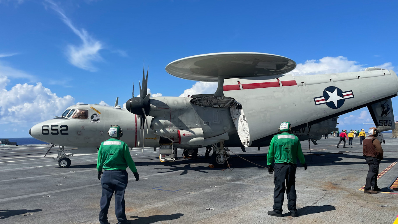 Crew of the USS George Washington prepare an E02 Hawkeye for takeoff on Sept. 15, 2023. (Photo by Steve Walsh)