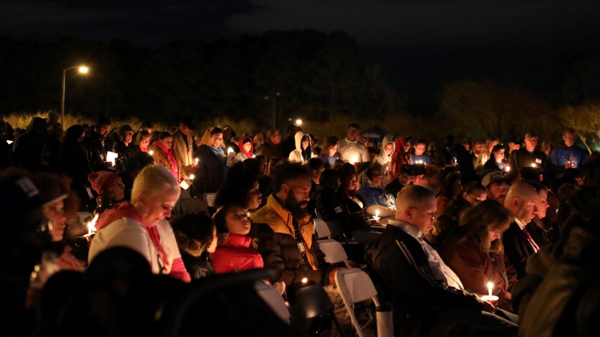 Hundreds gathered in City Park to mourn victims. Photo by Laura Philion.